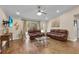 Open concept living room with hardwood floors and leather furniture at 5758 Nw 63Rd Pl, Ocala, FL 34482