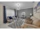 Cozy living room with plush seating, stylish decor, and bright natural light at 5758 Nw 63Rd Pl, Ocala, FL 34482