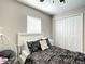 Bright bedroom with hanging chair, a closet, and a full sized bed is ready to move in at 634 Nw 56Th Ave, Ocala, FL 34482