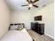 This bedroom offers a ceiling fan, a dresser, and a charming single bed with playful decor at 634 Nw 56Th Ave, Ocala, FL 34482