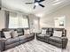 Bright living room featuring leather sofas, modern decor, and neutral paint colors at 634 Nw 56Th Ave, Ocala, FL 34482