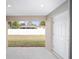 View from back porch to backyard with white privacy fence and neighbor's home at 6584 Se 108Th Ln, Belleview, FL 34420