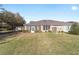 An outdoor view features a lovely screened porch in the backyard and a well-maintained lawn area at 7092 Sw 93Rd Ave # 1, Ocala, FL 34481