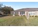 A charming home backyard featuring a screened patio, complimented by well-maintained landscaping and a vibrant lawn at 7092 Sw 93Rd Ave # 1, Ocala, FL 34481