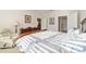 Bright bedroom showcases a large window, neutral carpet, comfortable furniture, and ample space for relaxation at 7092 Sw 93Rd Ave # 1, Ocala, FL 34481