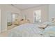 Bright bedroom with large window and mirrored closet featuring a white dresser at 7092 Sw 93Rd Ave # 1, Ocala, FL 34481