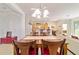 Open concept dining area showcasing the kitchen with a bar and open living area at 7092 Sw 93Rd Ave # 1, Ocala, FL 34481