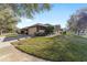 Beautiful home exterior with a two-car garage, complimented by well-maintained landscaping and a vibrant lawn at 7092 Sw 93Rd Ave # 1, Ocala, FL 34481