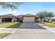 Well-maintained home with a spacious driveway and attached two-car garage at 7092 Sw 93Rd Ave # 1, Ocala, FL 34481