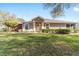 Charming home with a beautifully maintained lawn and landscaping, enhanced by a warm, inviting entrance at 7092 Sw 93Rd Ave # 1, Ocala, FL 34481