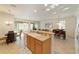 Open-concept kitchen with a breakfast bar, dining area and sunroom access at 7092 Sw 93Rd Ave # 1, Ocala, FL 34481