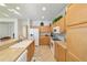 Bright kitchen with updated appliances, tile floor, and ample cabinet storage at 7092 Sw 93Rd Ave # 1, Ocala, FL 34481