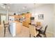 The kitchen features a breakfast bar, white appliances, and ample storage at 7092 Sw 93Rd Ave # 1, Ocala, FL 34481