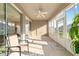 Covered lanai with sliding glass doors and sunshades offering an outdoor living space at 7092 Sw 93Rd Ave # 1, Ocala, FL 34481