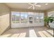 Relaxing lanai featuring sliding windows and serene backyard views at 7092 Sw 93Rd Ave # 1, Ocala, FL 34481