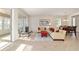 Living room with sliding glass doors leading to the enclosed patio at 7092 Sw 93Rd Ave # 1, Ocala, FL 34481
