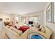 Cozy living room with view to enclosed porch at 7092 Sw 93Rd Ave # 1, Ocala, FL 34481