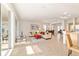Bright living room featuring tiled floors and sliding glass doors to an enclosed patio at 7092 Sw 93Rd Ave # 1, Ocala, FL 34481