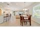 Spacious open-concept with dining area, kitchen bar, and a bright living area at 7092 Sw 93Rd Ave # 1, Ocala, FL 34481