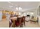 Open concept space with a dining table, adjacent kitchen, and a bright living area at 7092 Sw 93Rd Ave # 1, Ocala, FL 34481