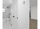 The bathroom is equipped with a shower, bathtub, and stylish white vanity at 7280 Se County Highway 25A, Belleview, FL 34420