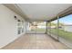 An enclosed patio offering views of the green backyard at 7280 Se County Highway 25A, Belleview, FL 34420