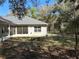 Enclosed backyard featuring a chain link fence, and a screened-in porch at 7550 Sw 185 Cir, Dunnellon, FL 34432