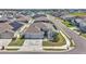 An elevated view of the home in a neighborhood, showing the fenced yard and proximity to other properties at 8371 Sw 59Th Ter, Ocala, FL 34476