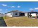 Home's backyard featuring a gazebo, manicured lawn, and privacy fence at 8371 Sw 59Th Ter, Ocala, FL 34476
