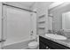 Clean bathroom featuring a tub and shower combo, granite countertops and modern hardware at 8371 Sw 59Th Ter, Ocala, FL 34476
