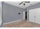 Comfortable bedroom with a ceiling fan and double door closet, perfect for relaxation and storage at 8371 Sw 59Th Ter, Ocala, FL 34476