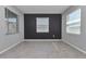 Neutrally decorated bedroom with gray walls, tile floors, and natural light from the windows at 8371 Sw 59Th Ter, Ocala, FL 34476