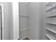 Well-organized closet with built-in shelving and hanging rods for efficient storage solutions at 8371 Sw 59Th Ter, Ocala, FL 34476