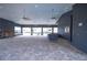 Spacious community clubhouse interior featuring a fireplace, ample seating, and a view of the pool at 8371 Sw 59Th Ter, Ocala, FL 34476
