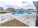 The refreshing community pool boasts paved surroundings and lounge area for relaxation at 8371 Sw 59Th Ter, Ocala, FL 34476