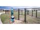 Community dog park with waste disposal and gated entry for a clean and safe environment at 8371 Sw 59Th Ter, Ocala, FL 34476