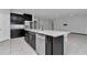Modern kitchen featuring stainless appliances, granite countertops, a kitchen island, and dark wood cabinetry at 8371 Sw 59Th Ter, Ocala, FL 34476