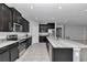 Sleek kitchen featuring stainless steel appliances, stone counters, and ample dark wood cabinets at 8371 Sw 59Th Ter, Ocala, FL 34476