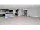 Spacious open-concept kitchen with dark cabinetry, stainless steel appliances, and large island at 8371 Sw 59Th Ter, Ocala, FL 34476