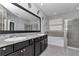 Main bathroom boasting double vanity, luxurious granite countertop, garden tub, and glass enclosed shower at 8371 Sw 59Th Ter, Ocala, FL 34476