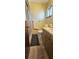 Well-maintained bathroom with neutral tile, a glass-enclosed shower, and a vanity with storage at 8516 Sw 105Th Pl, Ocala, FL 34481