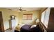 Bright bedroom featuring a ceiling fan, large windows and comfortable furniture at 8516 Sw 105Th Pl, Ocala, FL 34481