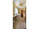 Functional laundry room with washer, dryer, ironing board, and storage at 8516 Sw 105Th Pl, Ocala, FL 34481