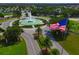 Aerial view of water fountain and American flag at 8961 Se 130Th Loop, Summerfield, FL 34491