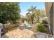 Picturesque backyard featuring a charming stone path and cozy seating, ideal for outdoor living at 8961 Se 130Th Loop, Summerfield, FL 34491