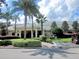 Beautiful clubhouse exterior with well-manicured landscaping, a welcoming entrance, and ample parking at 8961 Se 130Th Loop, Summerfield, FL 34491