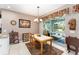 Dining area with outdoor access, traditional furnishings, and chandelier lighting at 8961 Se 130Th Loop, Summerfield, FL 34491