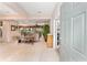 Inviting foyer with tile flooring leading to a spacious living area with natural light at 8961 Se 130Th Loop, Summerfield, FL 34491