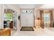 Welcoming foyer with a double front door, tile flooring and views to a front office at 8961 Se 130Th Loop, Summerfield, FL 34491