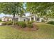 Well-maintained home with a two-car garage and lovely front yard landscaping at 8961 Se 130Th Loop, Summerfield, FL 34491